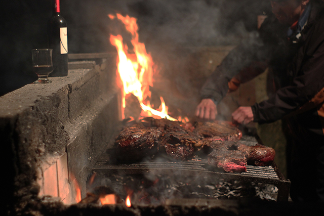 Asado, BBQ, meat on the BBQ, cooking with fire, steak, Peak Leaders in Argentina